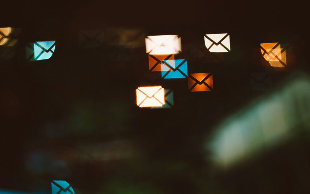 Featured image of a dark background with email symbols in the background, symbolising mailing lists.